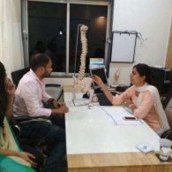 Dr Nivedita Page Providing Consultation for Back Pain
